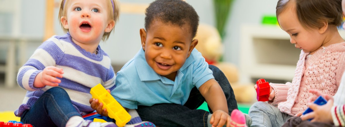 Diverse group of babies playing.